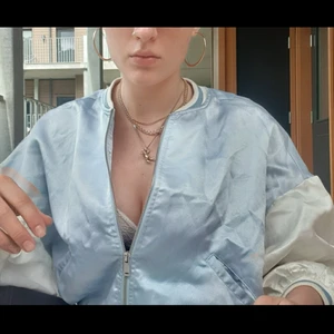 💦🐇Baby blue satin bomber 🦢💙  - Gorgous baby blue and white satin bomber jacket. Lightweight and perfect for the summer. The cut of this jacket gives it that oversized but still cropped look that just looks great on. Pre-loved but no noticeable flaws.