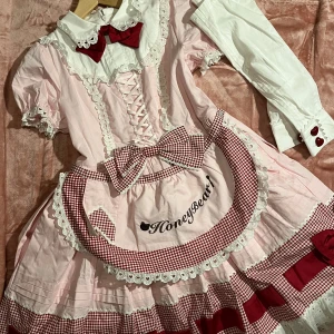 Lolita dress - Bought from an Chinese Lolita brand on taobao. Sweet Lolita maid. Never used still brand new but the heart thing got lost under the shipping 