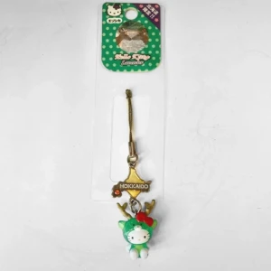 Grön Hello Kitty nyckelring från Hokkaido - Vintage mobilsmycke från Hokkaido, Japan. Skav på färg efter förvaring annars bra skick.