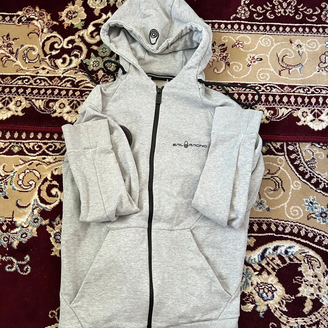Grå hoodiejacka från Sail Racing/byte