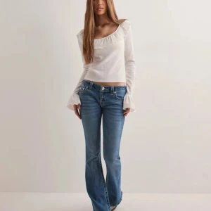 True Religion x Nelly Ultra low rise jeans - Selling True Religion x Nelly 'ultra low rise joey flare sn' jeans in w23! I've used these only a few times and they are in good condition👍Feel free to ask for details or more pictures!!