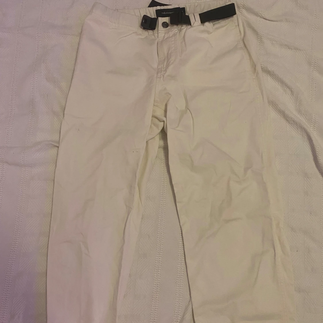 Vita chinos från Peak Performance