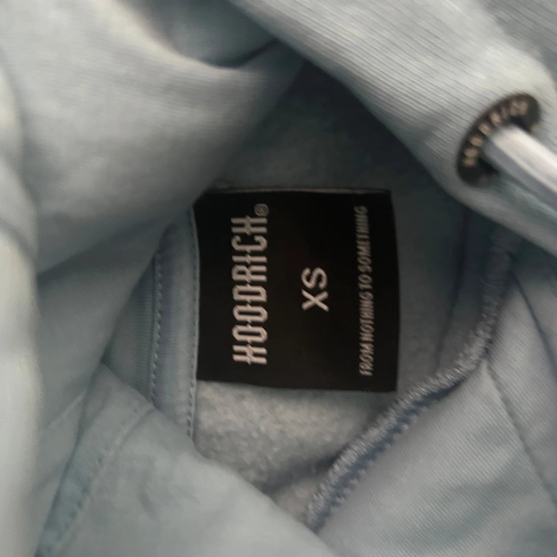 Ljusblå hoodie från Hoodrich XS - 1