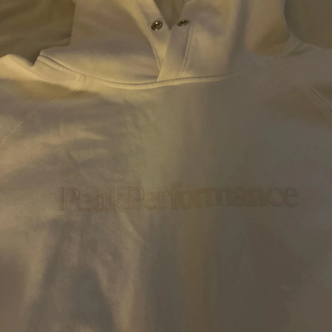 Vit hoodie från Peak Performance - 1