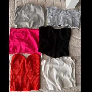 6-pack tubtoppar i olika färger - Säljer ett set med sex olika tubtoppar: en grå, en denim, en ribbad rosa, en svart spets, en ribbad röd och en vit. Olika märken. Säljer alla tillsammans!