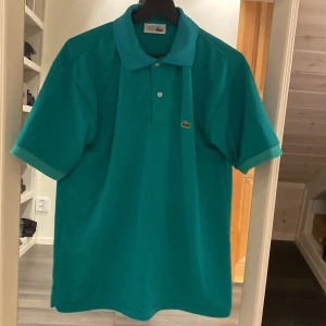 Lacoste Piké - En fin Lacoste Piké i gott skick. Pris ej hugget i sten