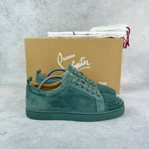 Christian Louboutin junior spike sneaker - – Condition: 9/10 - flawless  – Color: Green  - What is included: Dustbag & extra laces  – Retail price: 9000 + SEK
