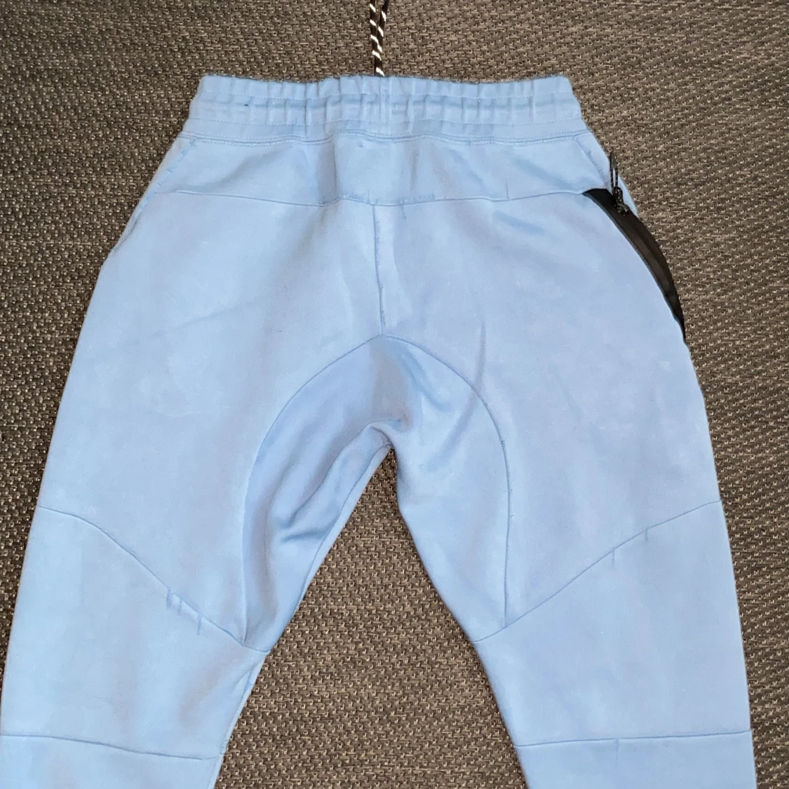 Nike ljusblå mjukisbyxor med snörning - 1