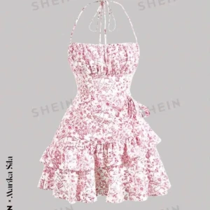 Blommig klänning från SHEIN - Söt blommig klänning från SHEIN i rosa och vit. Klänningen har en volangdetalj och knytning i ryggen. Perfekt för sommarens varma dagar med sin ärmlösa design och korta längd.