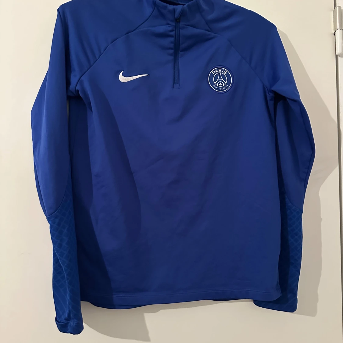 Blå långärmad träningströja från Nike PSG
