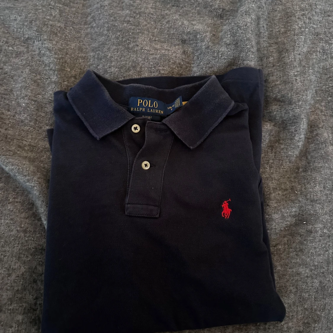Mörkblå pikétröja från Ralph Lauren