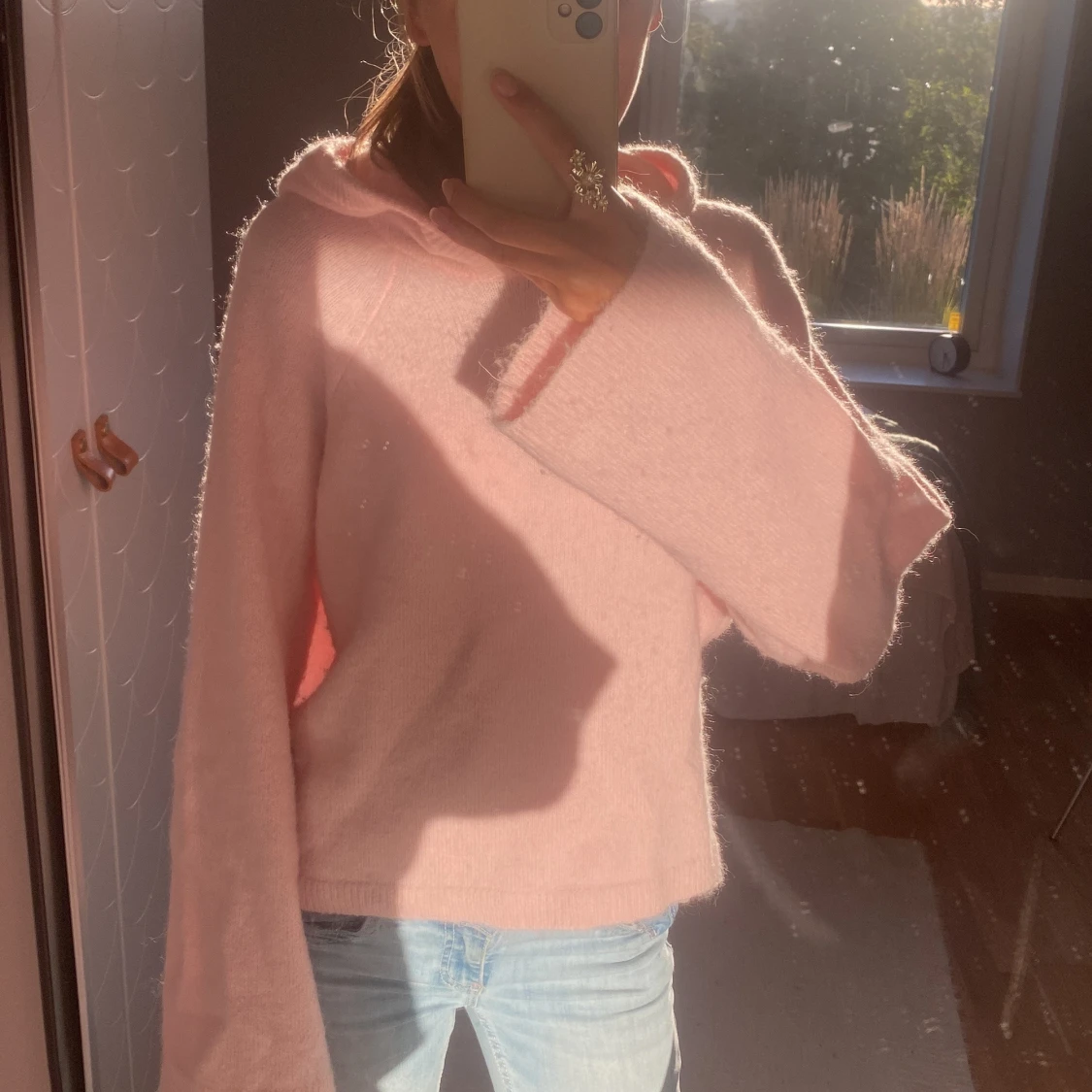 Ljusrosa stickad hoodie från Gina Tricot