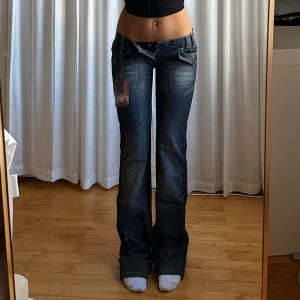 Lågmidjade bootcut jeans - Vintage från Reactive med lapp kvar, (försmå)💕midja 38 innerben 87