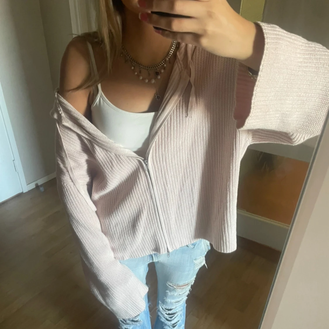 Ljusrosa stickad hoodie med dragkedja