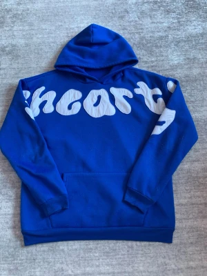 Streetwear hoodie - Blue hoodie in great condition. Soft and comfortable material, perfect for everyday wear. Features a bold white text design across the chest and sleeves, giving it a clean streetwear look ✨🔥. Comes with a hood and front kangaroo pocket.  Size: M Price is negotiable 💬💸