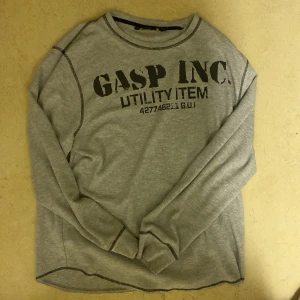 Grå långärmad tröja från Gasp - Storlek m overzised