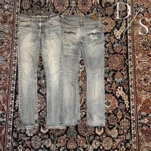 Vintage nudie Lean Dean jeans - Riktigt schyssta nudie jeans! Dessa är i bra kvalitet och är i slim fit modellen ”Lean Dean” modellen är 187 väger 65kg, jag tror att man kan definitivt va kortare o ha dessa. Skulle säga att 175-187 e bra längd jag kör rätt mycke häng på bilden! De kan även sitta lite lösare på mindre personer! Färgen är inte lika cool wash på sista bilden de är för den e tagen i mörkt ljus medans dem andra e tagna i ljust ljus Mått: Midja:39cm Längd:100cm Benöppning:15,5cm