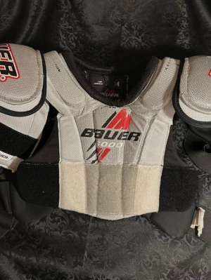 Hockeybröstskydd Bauer M/M JR  - Gammal Hockeybröstskydd JR 