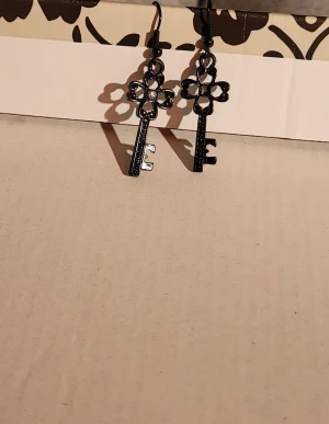 Key earrings - Black metal key shaped earrings with gem, used once or twice.  3.5cmx1.5cm