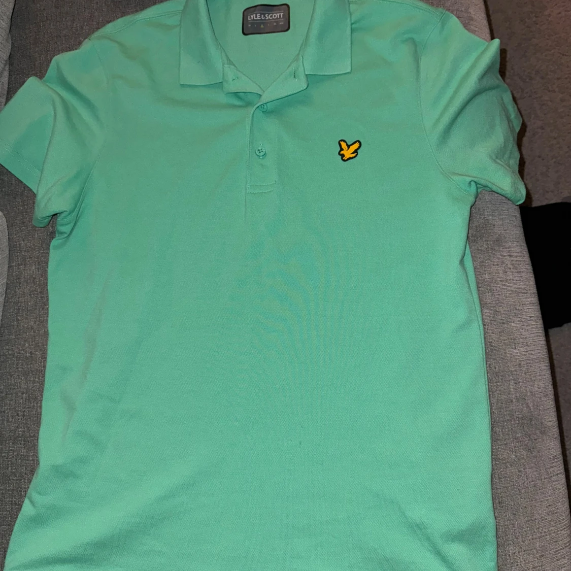 Mintgrön pikétröja från Lyle & Scott