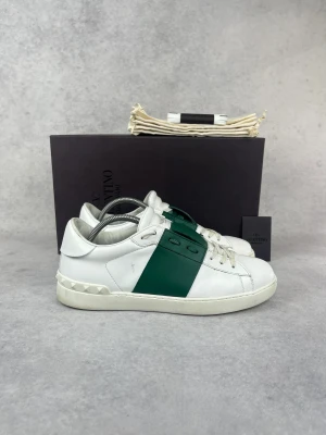 Valentino  Open sneakers  - – Condition: 8,5/10  – Color: White and green  – What is included: Box, dustbag, card & extra laces  – Retail price: 7280
