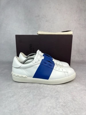 Valentino  Open sneakers  - – Condition: 9/10  – Color: White and blue  - What is included: Box, dustbag & card  – Retail price: Over 700 euro