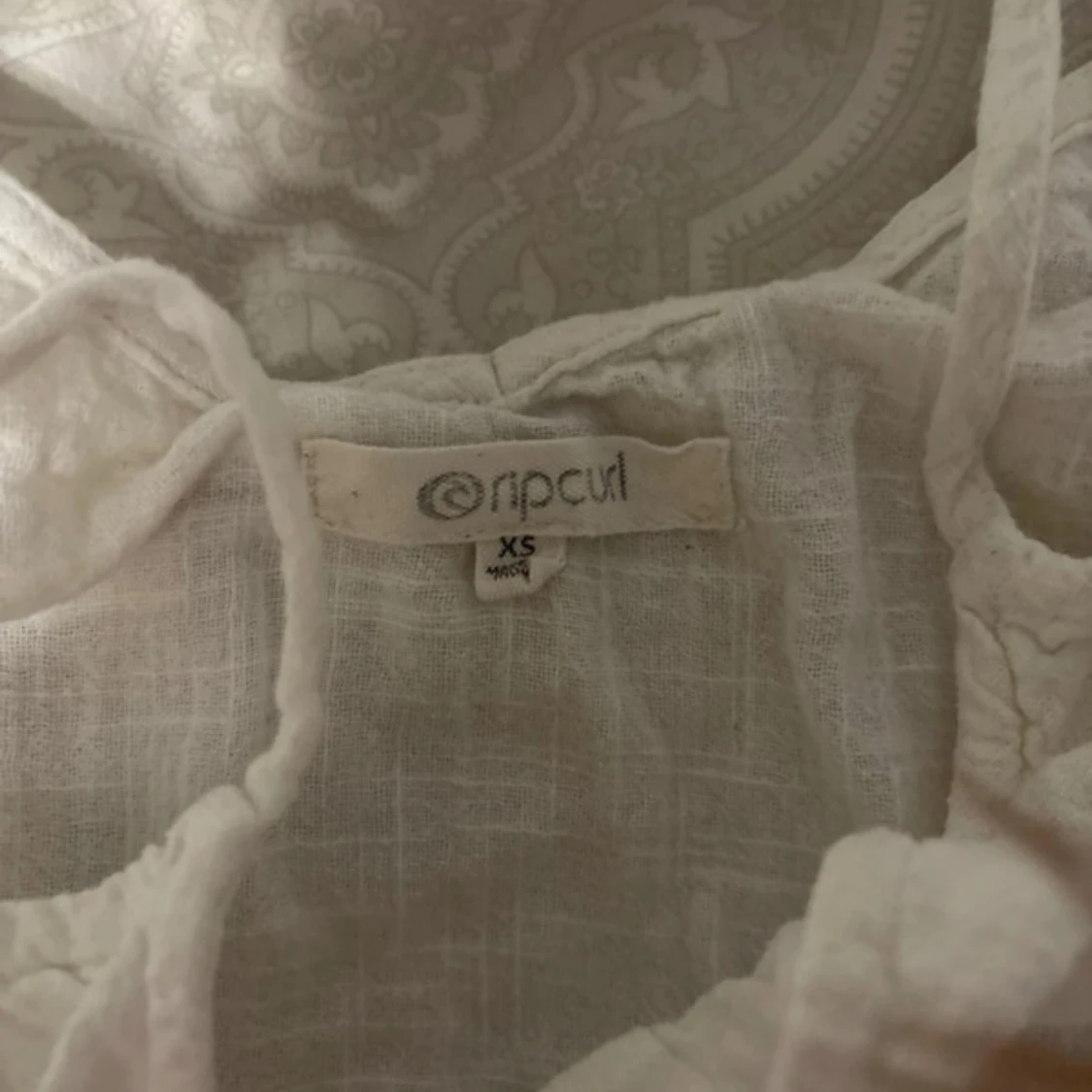 Vit linnetopp från Rip Curl XS - 2