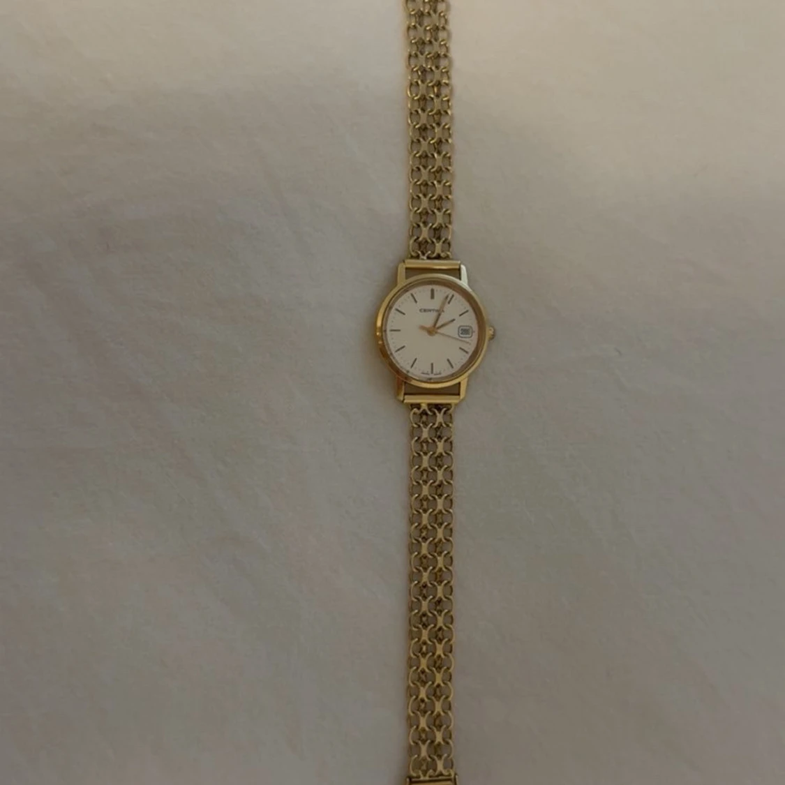 Guldfärgad Longines armbandsur