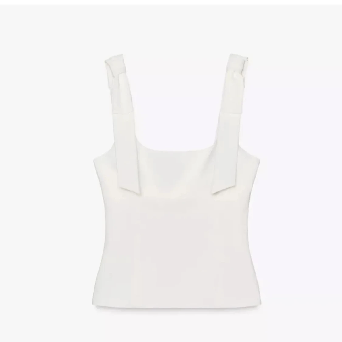 Vit linnetopp med knytband