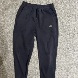 Lacoste navy blue sweatpants - Size M