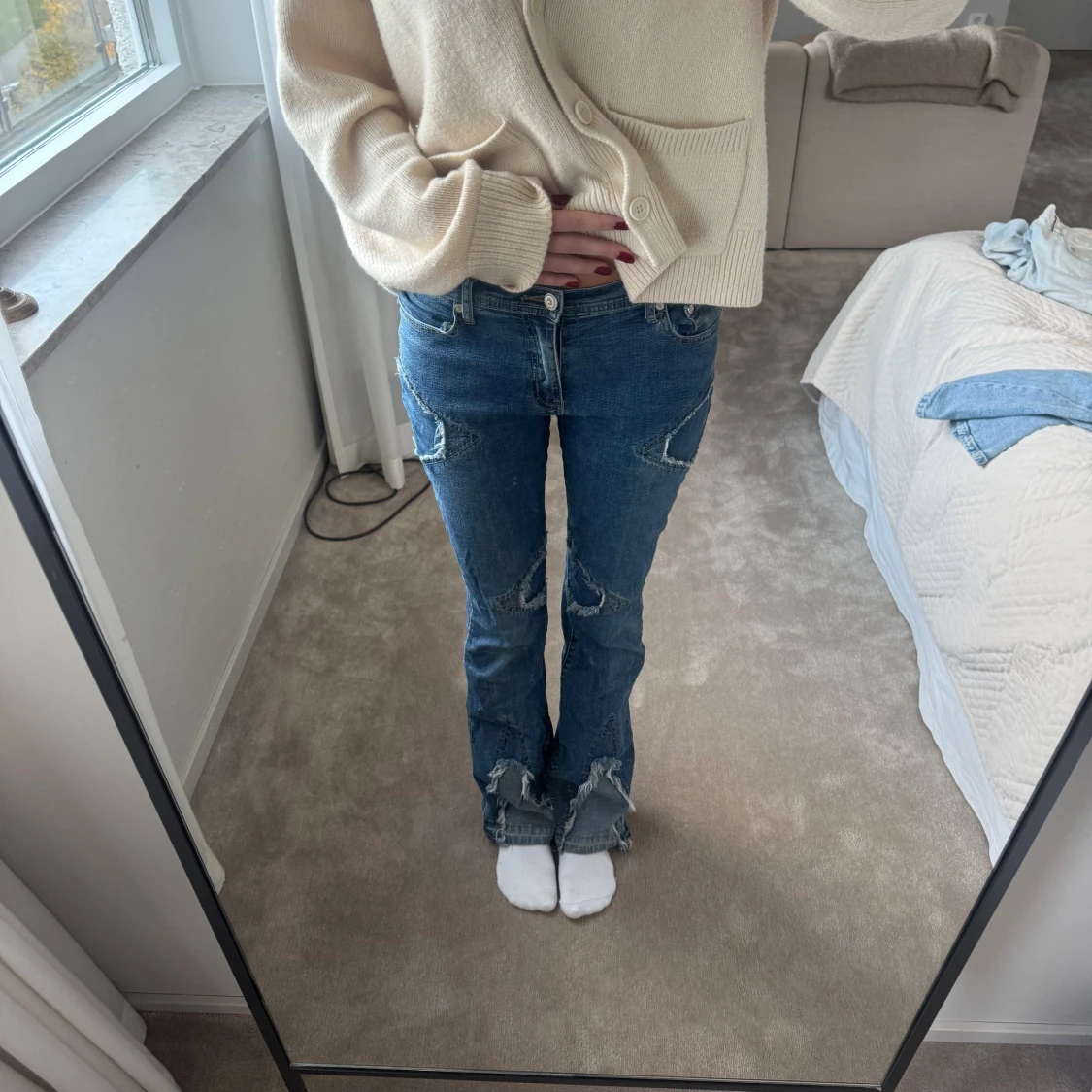 Blå bootcut jeans med detaljer
