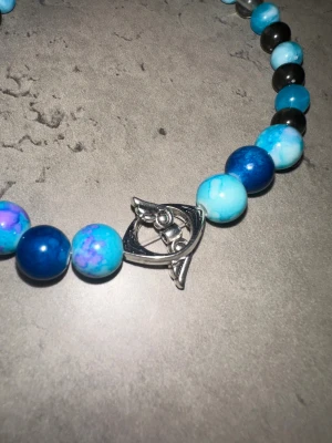 Angelwings-blue-black - Ett jätte fint armband som passar alla storleken är 16 cm jätte fint och det kostar 100kr plus frakt 