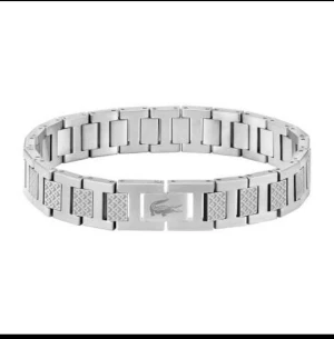Silvrigt armband från Lacoste - Stilrent armband i silverfärgat rostfritt stål från Lacoste. Aldrig använt 