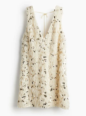 Paljettklänning från H&M - Fluffig glittrig paljettklänning från HM i storlek S, i vit/creme färg. Perfekt för julfesten och nyår!