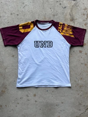 Upcycled raglan t-shirt - Upcycled raglan tee we’ve sewn, combining two vintage graphic tees. Boxy fit and in great condition, 100% cotton