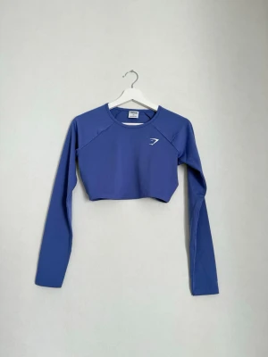 Långärmad träningströja – Gymshark – Storlek XS - Långärmad tröja med tumhål från Gymshark, storlek XS. Mycket fint skick!