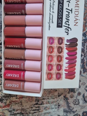 10 pcs Meidian Dreamy Non-Transfer Lip Gloss Set  - Meidian Dreamy Non-Transfer Lip Gloss Set with 10 lip gloss in different shades. The lip gloss is "delicate & smooth" and "lasting without decolorization." Shipping same day if you order before 12:00