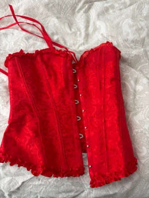 Korsett  - Röd korsett i storleken S 
