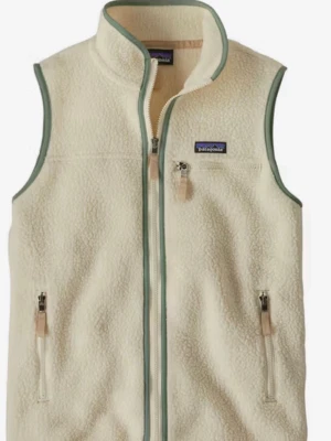 Vit fleeceväst från Patagonia - Säljer en krämvit fleeceväst från Patagonia med hel dragkedja och tre fickor med dragkedja. Västen har en hög krage och ljusgröna kantband. Perfekt för lager-på-lager och chill stil.