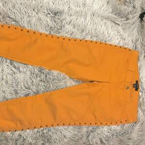 Cool yellow/orange pants with spikes