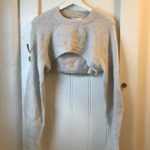 Ljusgrå bolero - Ribbad ljusgrå bolero, strl S 