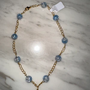 Bolsmycke helt ny i blå färg  - Helt ny 