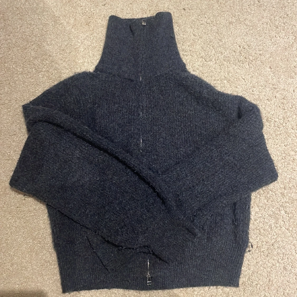 Stickad zip-up tröja