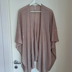 Poncho  - Använd få gånger 