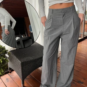 Kostymbyxor  - Gråa kostymbyxor, high-waist med rak passform.  Fraktkostnad tillkommer. 