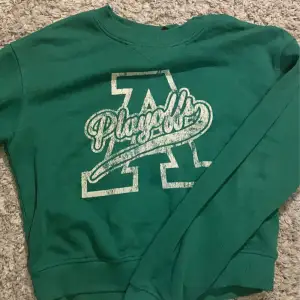 Grön sweatshirt från H&M i storlek S