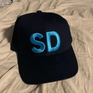 SD keps  - Kan posta om köparen betalar frakt. Ge mig bud 
