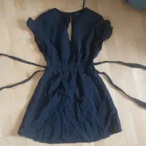 Never worn, black dress with shorts under 