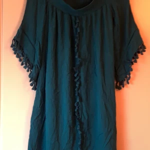 Klänning - Turkosblå klänning i strl M, nyskick