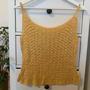 Yellow coloured vintage top detailed with beads. Top is knit material.